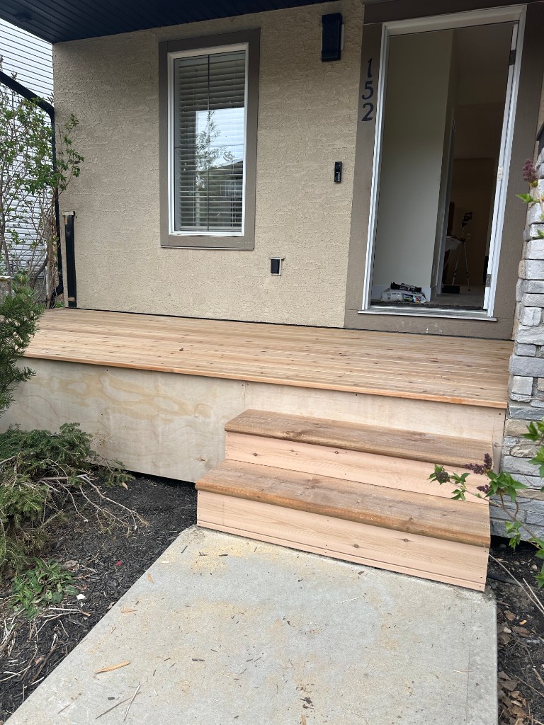 Cedar front landing, stairs, and house number 152