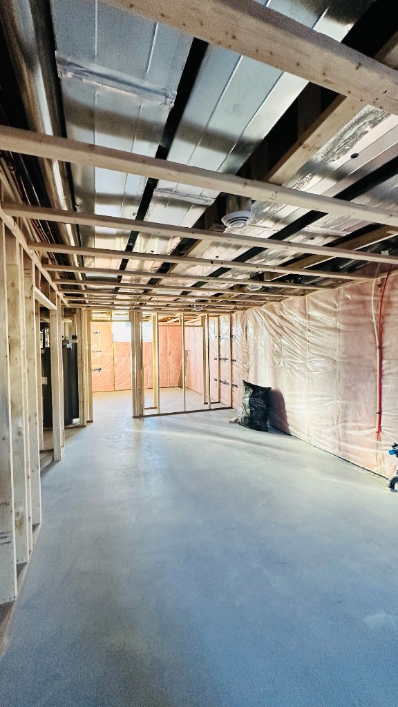 Framed basement room with insulation and vapor barrier