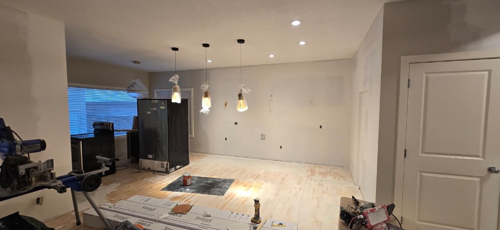 Open kitchen space during lighting and flooring install